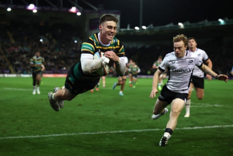 Tommy Freeman of Northampton Saints scores a try.