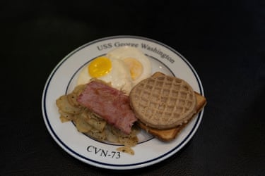 A breakfast plate of eggs, ham, potatoes, French toast and a waffle aboard the USS George Washington. The aircraft carrier is capable of carrying more than 5,000 personnel.