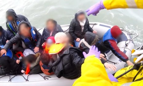 A dinghy full of migrants being rescued by the RNLI in the English Chanel.