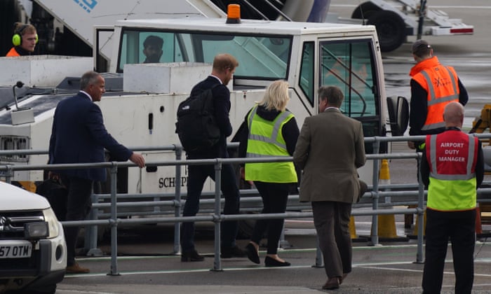 Prince Harry, Duke of Sussex boards a flight at Aberdeen Airport.