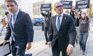 Activist with Rise and Resist follow Igor Fruman, right, as he arrived in Federal court in Manhattan with his attorney Todd Blanche today. Fruman, a businessman who helped Rudy Giuliani in his effort to dig up dirt on Joe Biden in Ukraine, was scheduled to appear in court for an expected guilty plea in a case involving allegations of illegal campaign.