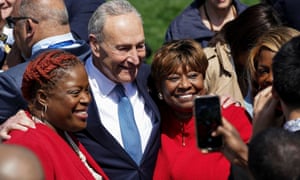 Senate Majority Leader Chuck Schumer (D-NY) poses with guests as he arrives prior to Joe Biden hosting a celebration of Judge Ketanji Brown Jackson’s confirmation as the first Black woman to serve on the U.S. Supreme Court, on the South Lawn at the White House.