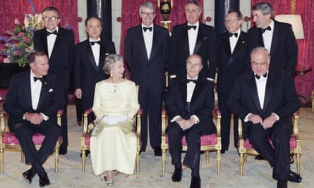 Queen Elizabeth poses with G7 leaders at Buckingham Palace in July 1991. From left: George Bush Sr (US), Giulio Andreotti (Italy), Toshiki Kaifu (Japan), John Major (UK), Francois Mitterrand (France, seated), Brian Mulroney (Canada) Jacques Delors (European Commission), Helmut Kohl (Germany, seated) and Ruud Lubbers (Netherlands).