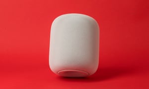 an apple homepod tilted at a slight angle against a red background
