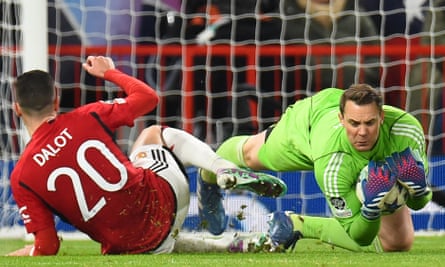 Bayern Munich's keeper Manuel Neuer makes a save during the Champions League group game at Manchester United.