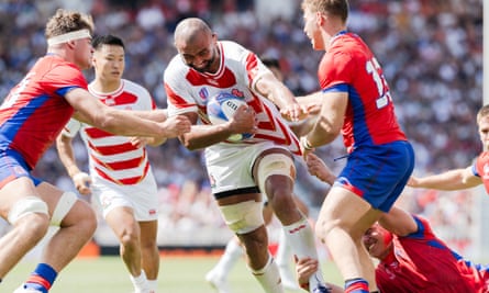 Michael Leitch carries the ball for Japan