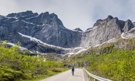 A cyclist on the road to Nusfjord, Lofoten Islands.