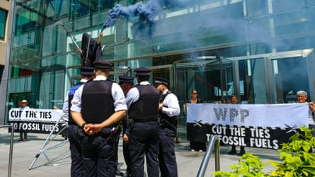 Police officers astatine Extinction Rebellion objection astatine nan offices of WPP