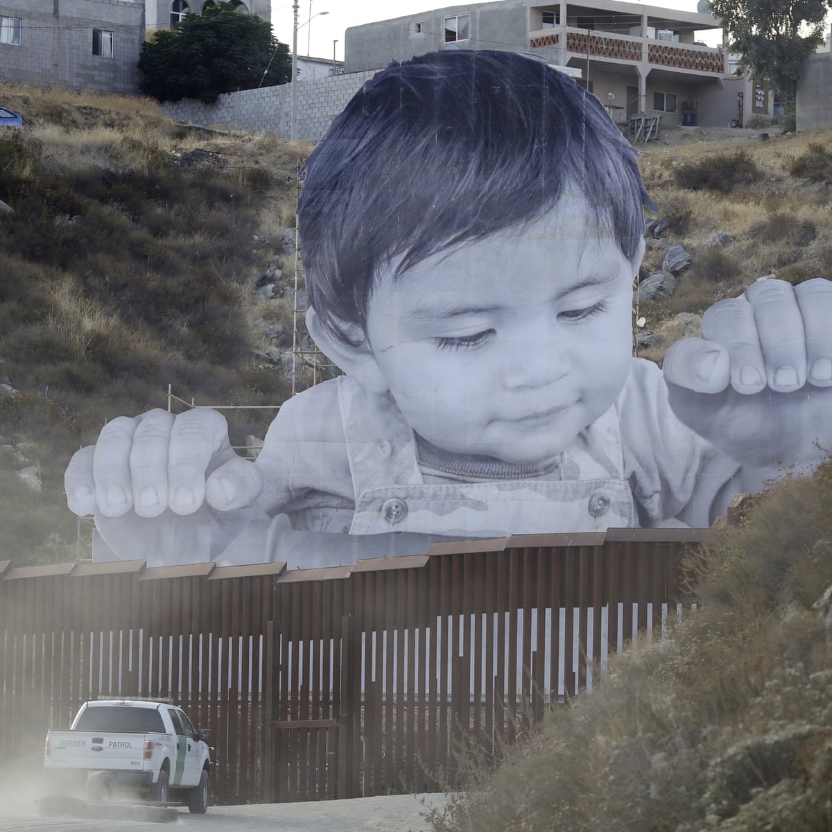 Giant Portrait Of Toddler Peers Over Us Mexico Border Wall Mexico The Guardian Giant Portrait Of Toddler Peers Over Us Mexico Border Wall Mexico The Guardian