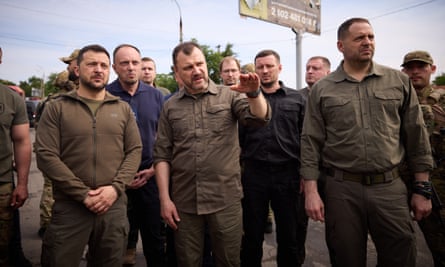 The Ukrainian president, Volodymyr Zelenskiy, visiting the flood-hit southern region of Kherson.