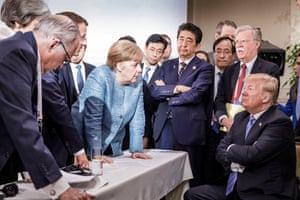 Angela Merkel deliberates with Donald Trump on the sidelines of the official agenda at the G7 summit on in Charlevoix, Canada