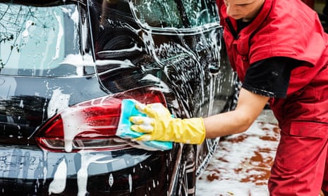 A man washes a car