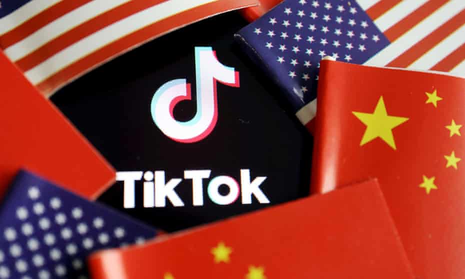 China and US flags are seen near a TikTok logo.