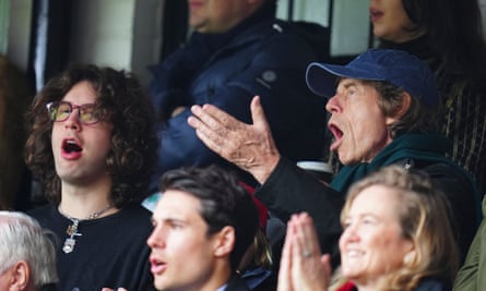 Mick Jagger celebrates the first Arsenal goal alongside son Lucas.