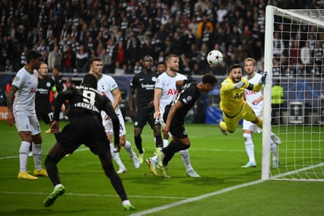 Hugo Lloris punches clear under pressure.