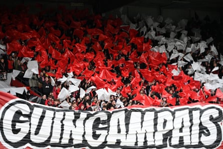 Guingamp supporters wave flags during the French Cup match against Stade Rennais.