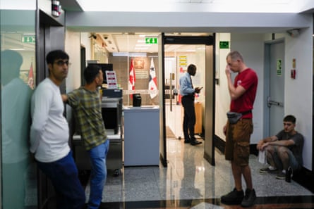 people stand in a corridor