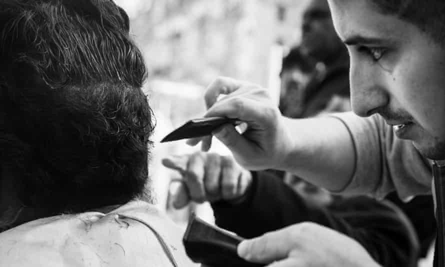 Meet Floki, the street barber of Perth: ‘It’s not just about the haircut’ Ali Bouazar trims a client’s hair