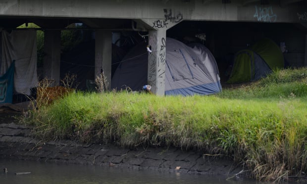 Homeless people camp under a bridge in Melbourne, Tuesday, April 28, 2015.