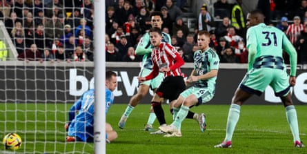 Mathias Jensen scores Brentford’s third goal in the victory