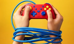 hands tied by a wire round a gaming console