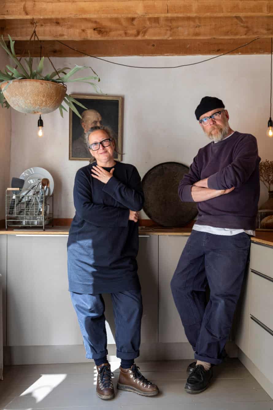 Cooking up a storm: Nicola Helgesen and Andreas Bleckmann in the kitchen. Nicola was a fashion designer before she made the move to the south coast, and has now created a business, Oldtownhaus, that sells vintage and antique objects that fit in with the aesthetic of their home. Andreas is a photographer.
