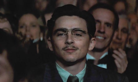 Timothée Chalamet watching a show in a theatre in Marty Supreme.