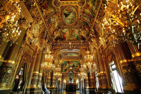 The gilded foyer of the opera house, with painted ceilings and chandeliers