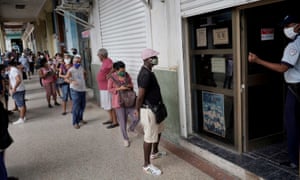 People wait in line to enter a currency exchange office in Havana, Cuba, 9 September 2020.