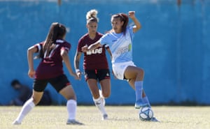 Mara Gómez, of Villa San Carlos, right, controls the ball during an Argentina professional women’s soccer league match against Lanús in La Plata, Argentina, Monday, Dec. 7, 2020. The 23-year-old forward is the first transgender player in Argentina’s professional women’s soccer league.