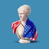 a white female bust with an american flag draped on its shoulders