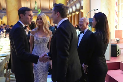 Elon Musk talks shakes hands with Jared Kushner as Ivanka Trump and Jeff Bezos, second from right, and Shivon Zillis, watch, before president-elect Donald Trump speaks at a dinner at the Building Museum, Sunday, 19 January.