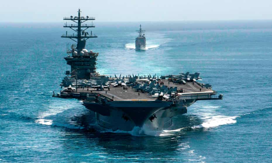 The aircraft carrier USS Nimitz and the guided-missile cruiser USS Philippine Sea in formation as they transit the Strait of Hormuz in the Persian Gulf.