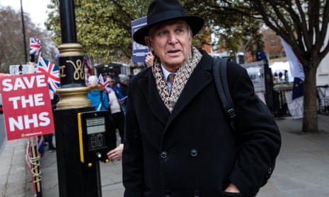 Sir Vince Cable walks past Brexit protesters outside parliament
