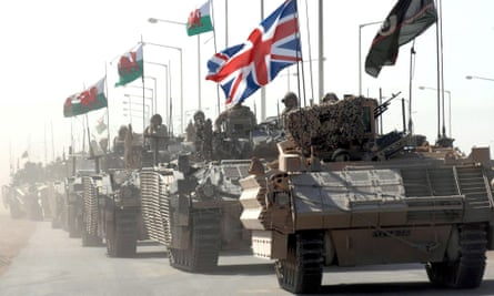 A convoy of armoured personel carriers holding British forces returning to the contingency operating base after the handover of Basra Palace to the Iraqi Palace Protection Force on 3 September 2007.