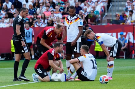 Nico Schlotterbeck receives medical attention after sustaining an injury