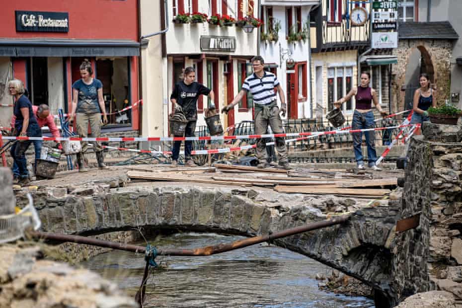 Residents clear debris in Bad Muenstereifel, Germany.