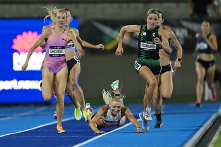 Jessica Hull falls on the final straight as Abbey Caldwell and Claudia Hollingsworth race to the finish in the women’s 1500m.