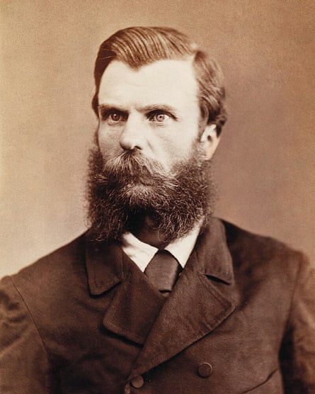 A black and white picture of a man with a beard