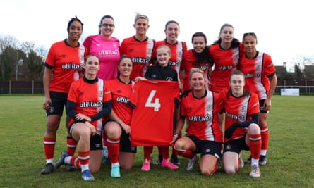 Luton Town’s women’s team hold up Tom Lockyer’s No 4 shirt before their FA Cup tie against Keynsham on Sunday.