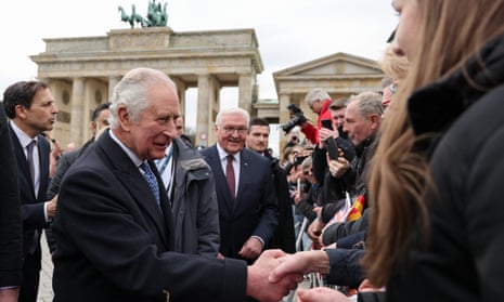 King Charles shakes hands with wellwishers at the Brandenburg Gate in Berlin
