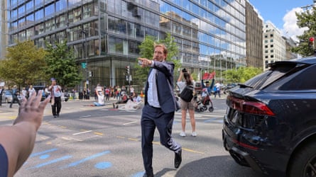 a man points in the street