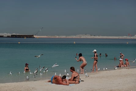 People relax at the beach
