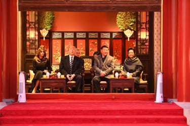 President Trump beside First Lady Melania Trump, China’s President Xi Jinping and his wife Peng Liyuan seated on a stage with red carpet in front of them