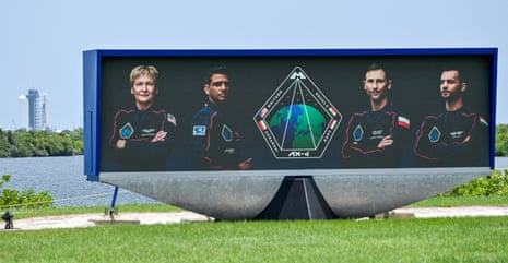 Axiom-4 astronauts, commander Peggy Whitson of U.S., pilot Shubhanshu Shukla of India, mission specialist Sławosz Uznański-Wiśniewski of Poland and mission specialist Tibor Kapu of Hungary, are pictured on the countdown video clock, as the SpaceX Falcon 9 rocket stands at Launch Complex 39-A in Cape Canaveral, Florida, US.