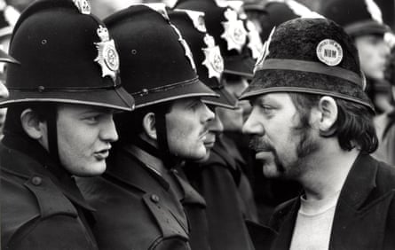 NUM picket George Brealey faces off with police officers.