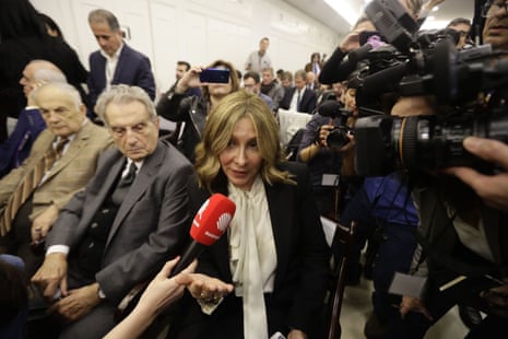 LEBANON-JAPAN-FRANCE-GHOSNJournalists surround Carole, the wife of former Renault-Nissan boss Carlos Ghosn, during his press conference at the Lebanese Press Syndicate in Beirut on January 8, 2020. - The 65-year-old fugitive auto tycoon vowed to clear his name as he made his first public appearance at a news conference in Beirut since skipping bail in Japan. Carlos Ghosn, who denies any wrongdoing, fled charges of financial misconduct including allegedly under-reporting his compensation to the tune of $85 million. (Photo by JOSEPH EID / AFP) (Photo by JOSEPH EID/AFP via Getty Images)