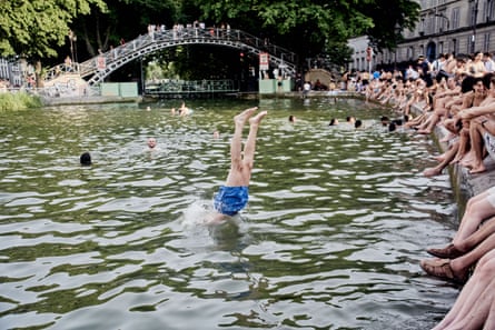 A person dives into water.