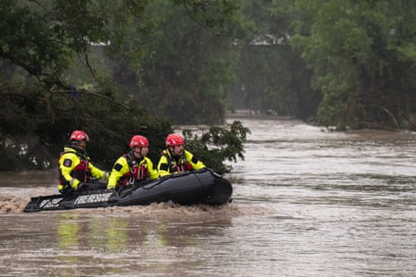 Search and Rescue teams navigate upstream in an inflatable boat on the flooded Guadalupe River on 4 July 2025 in Comfort, Texas.