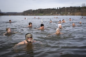 Swimmers during the traditional New Year’s Eve swim at lake Moossee.